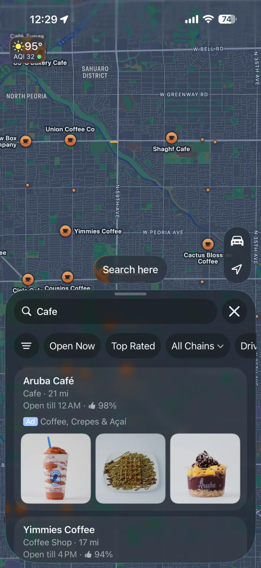 Apple Maps search for Cafe showing Aruba Café as a sponsored result with an Ad badge